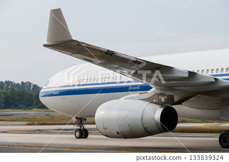 Wide body jet airliner taxiing on the runway Wide body jet airliner taxiing on the runway 133839324