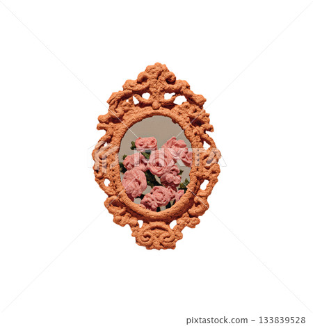 Exquisite vintage embroidered rose bouquet artfully displayed within an ornate, textured peach-toned oval frame, evoking timeless elegance and delicate beauty for decorative projects. 133839528