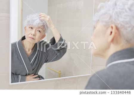 Senior woman with hair problems Senior woman with hair problems 133840446