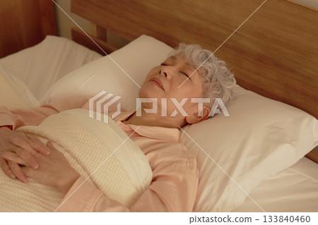 Senior woman sleeping in bedroom Senior woman sleeping in bedroom 133840460
