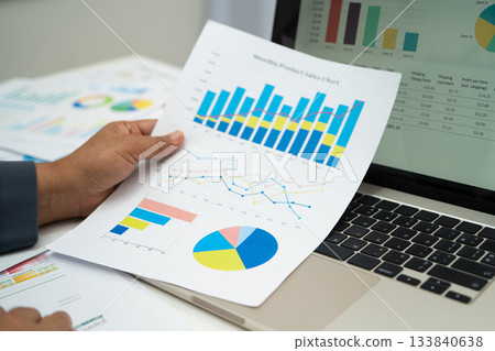 Asian business woman working with financial graph. 133840638