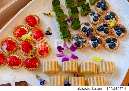 A dessert plate with a colorful array of sweets A dessert plate with a colorful array of sweets 133840724