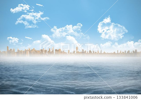 Cityscape on horizon over ocean Cityscape on horizon over ocean 133841006