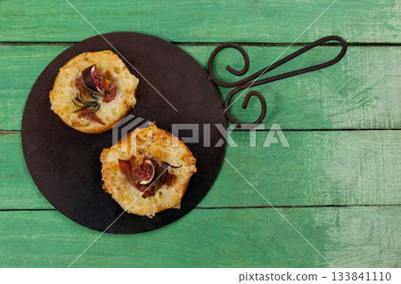 Fresh food with tray on green wooden table 133841110