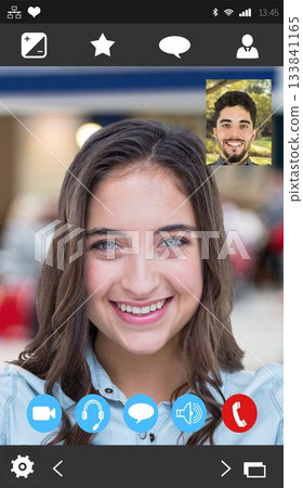 Device screen showing call interface featuring smiling woman with man thumbnail and control icons Device screen showing call interface featuring smiling woman with man thumbnail and control icons 133841165