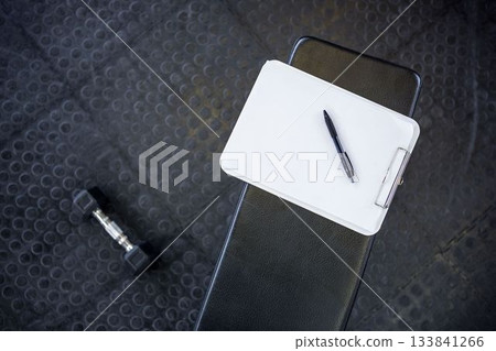 Overhead shot of note pad and pen 133841266