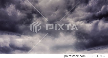 Mass of storm clouds is forming in flat design illustration, showing dark turbulent sky 133841432