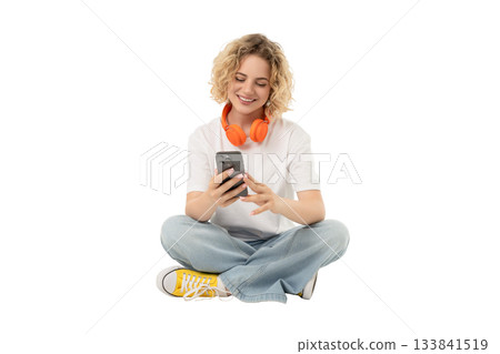 Person engages with smartphone and enjoys music, isolated, PNG 133841519