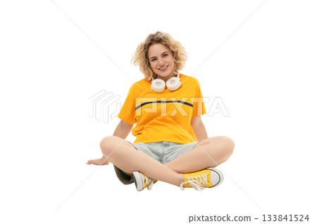 Woman in casual wear with headphones seated, isolated on white, PNG Woman in casual wear with headphones seated, isolated on white, PNG 133841524