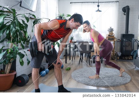 Joint Strength training of husband and wife at home with dumbbells Joint Strength training of husband and wife at home with dumbbells 133842014