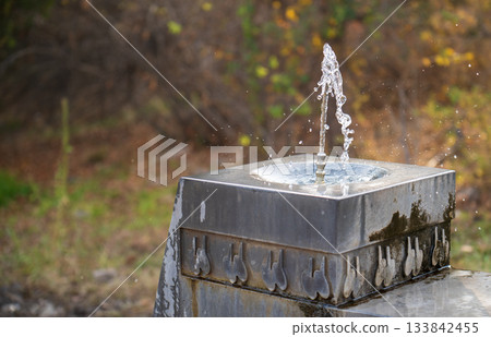A fountain with water shooting out of it A fountain with water shooting out of it 133842455