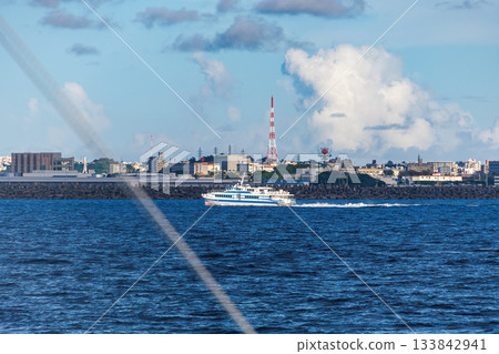 A high-speed jet ferry bound for Tokashiki Island in the Kerama Islands. Marine Liner Tokashiki. Boarding Queen Zamami No. 3. 133842941