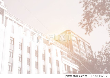 Bottom-up view of building with bright light Bottom-up view of building with bright light 133843207