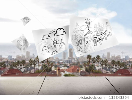 Sheets with graphics on cityscape background 133843294