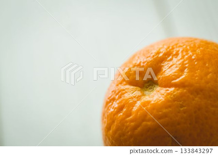 Orange fruit on wooden table 133843297