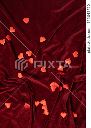 Maroon Velvet Fabric Background Scattered With Festive Red Heart-Shaped Confetti Maroon Velvet Fabric Background Scattered With Festive Red Heart-Shaped Confetti 133843710