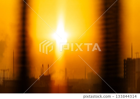 The light of the morning sun that looks like a cross seen through the window of a high-rise room The light of the morning sun that looks like a cross seen through the window of a high-rise room 133844314