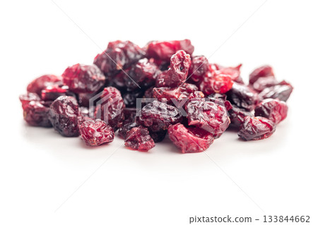 Tasty dried cranberries isolated on white background. Tasty dried cranberries isolated on white background. 133844662