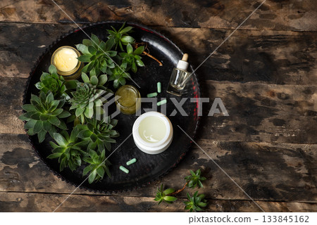 Natural Succulent and Cosmetic Products on Rustic Wooden Table Natural Succulent and Cosmetic Products on Rustic Wooden Table 133845162