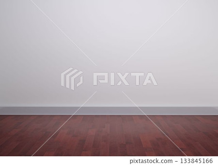 Empty room is showcasing smooth light-colored wall above dark wood floor, flat design copy space 133845166