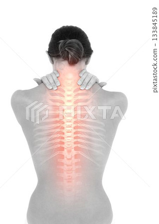 Woman experiencing back pain Woman experiencing back pain 133845189