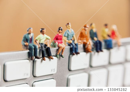 Figurines arranged on keyboard Figurines arranged on keyboard 133845282