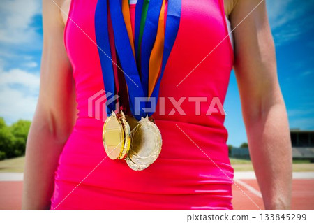 Midsection of medalist standing outdoors 133845299