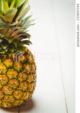 Fresh pineapple on wooden table Fresh pineapple on wooden table 133845344