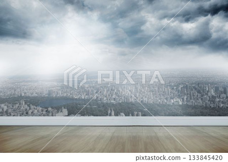 Flat design is showing light-wood floor and white wall via glass window revealing skyline and park 133845420