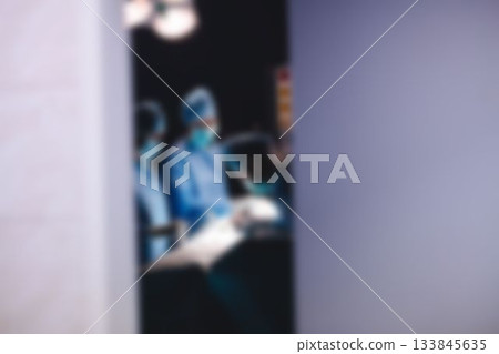 Surgery team operating a patient in an operating room 133845635