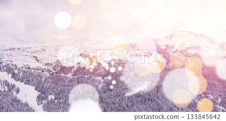 Snowcapped mountains with bokeh in foreground 133845642