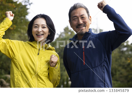 A middle-aged couple running 133845879