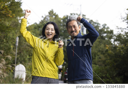 A middle-aged couple running A middle-aged couple running 133845880