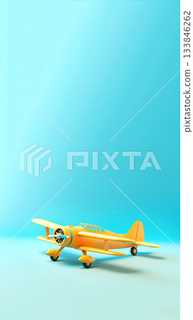 Yellow toy biplane on light blue background. Minimalist vintage aircraft model, clean pastel aesthetic. a social media story or reel, providing vast copy space for travel or holiday promotions 133846262
