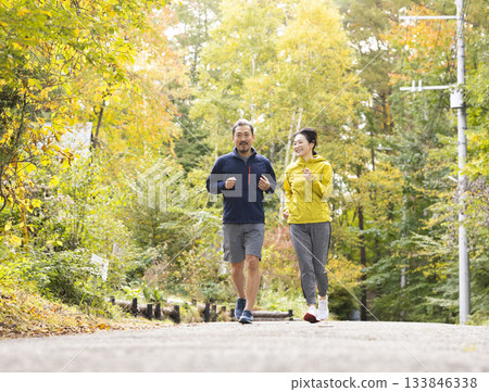 A middle-aged couple running 133846338