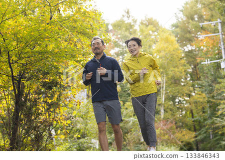 A middle-aged couple running 133846343