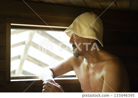 A man in his 50s enjoying the sauna A man in his 50s enjoying the sauna 133846395