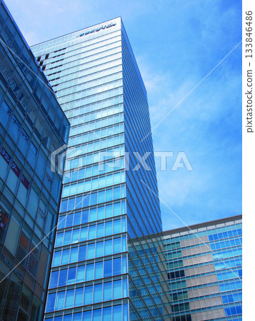Akihabara UDX Building and other buildings against the blue sky Akihabara UDX Building and other buildings against the blue sky 133846486
