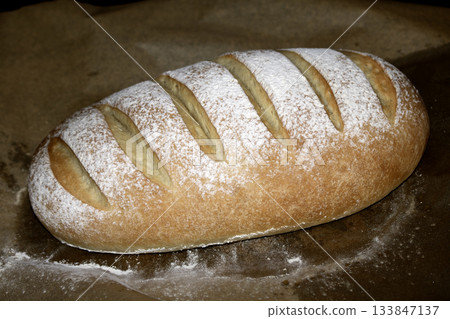 Close up of home made freshly baked bloomer of bread Close up of home made freshly baked bloomer of bread 133847137
