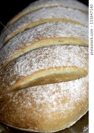 Close up of home made freshly baked bloomer of bread Close up of home made freshly baked bloomer of bread 133847140