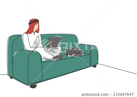 Continuous one line drawing arab man sitting cross legged on sofa with laptop on lap and cat lying down. Remote work abroad. National Work From Home Day. Single line draw design vector illustration 133847647