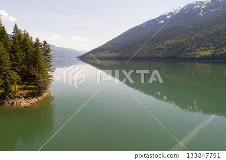 Idyllic view of lake and mountains 133847791