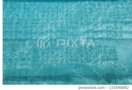 Mosaic tiles and built-in steps are showing through rippling water under sunlight in vector art Mosaic tiles and built-in steps are showing through rippling water under sunlight in vector art 133848062
