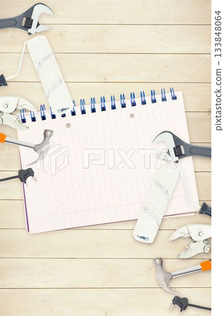 Tools and notepad on wooden background 133848064
