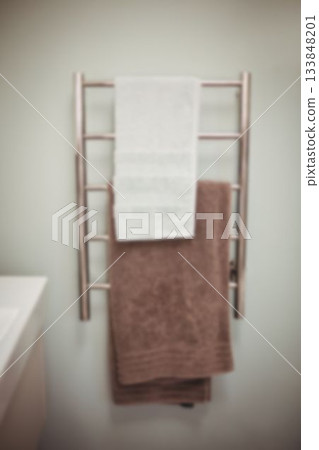 Towels hanging on rack in bathroom Towels hanging on rack in bathroom 133848201