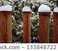 Sleet piled up at the end of the bamboo fence 133848722