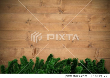 Fir branches over wooden planks 133849177