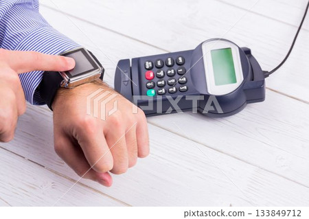 Man using smart watch to express pay 133849712