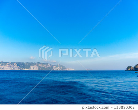 Niijima Island seen from Nobuse Port on Shikinejima Island in the evening Niijima Island seen from Nobuse Port on Shikinejima Island in the evening 133850302