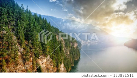 Mountain by river against sky Mountain by river against sky 133851511